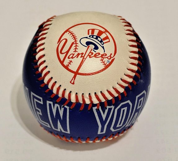 New York Yankees logo on a baseball for a team sponsor