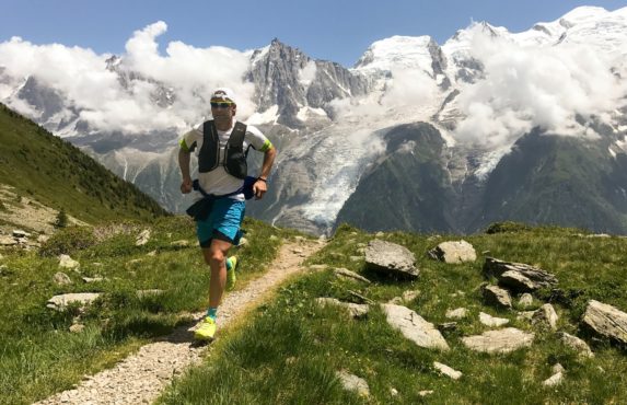 Man running through mountains training like a salesperson preparing for a deal